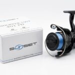 SUNSET Sunhopper SWF 401 FD black fishing reel with blue line on the spool and product box