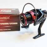 Accuretta LY series spinning fishing reel in black and red with its product box